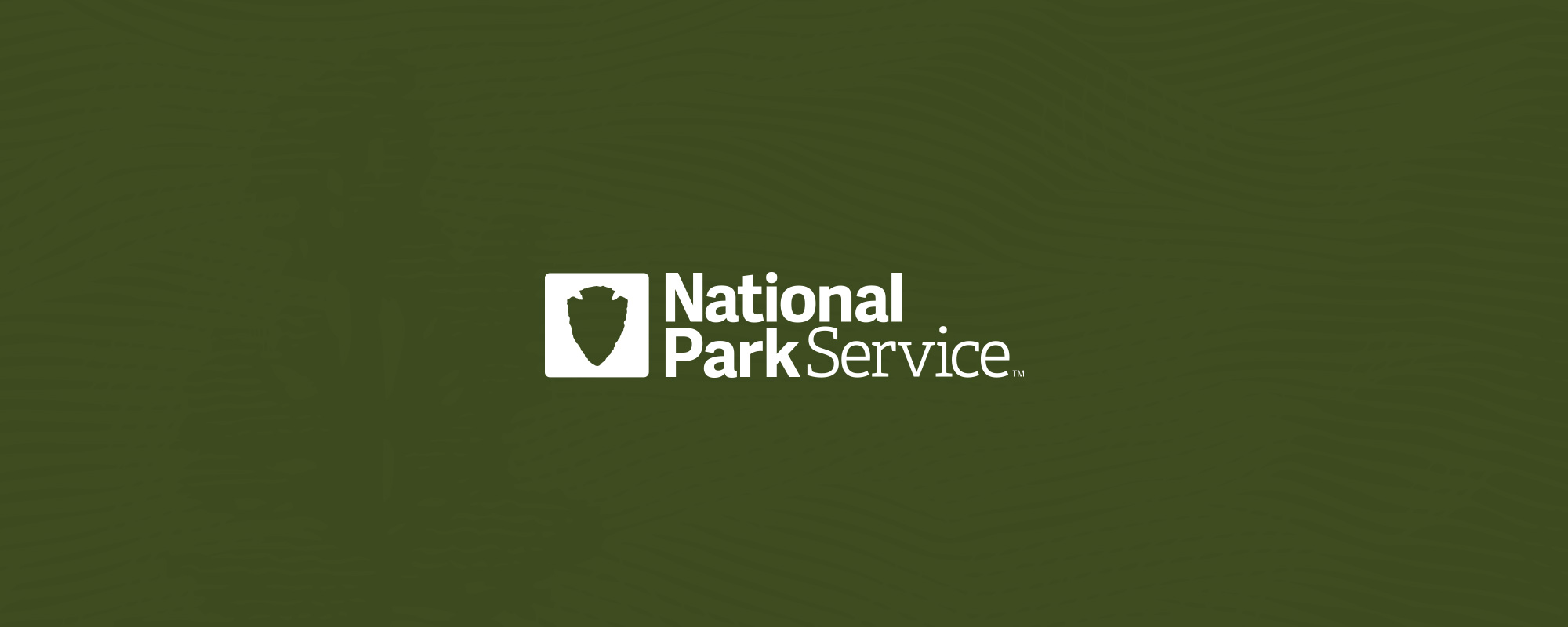 National Park Service centennial identity on topographic green
